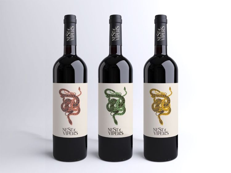 Three black wine bottles each with a different colored viper design