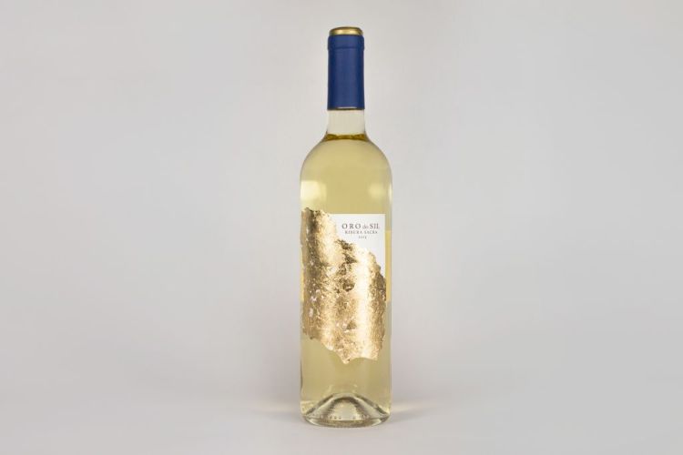Clear white wine bottle with gold label