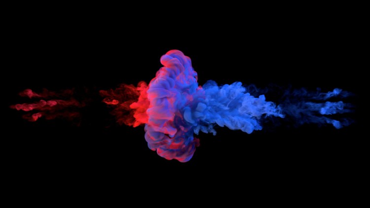 Blue and red ink swirling underwater